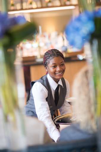 Waitress serving cocktails 