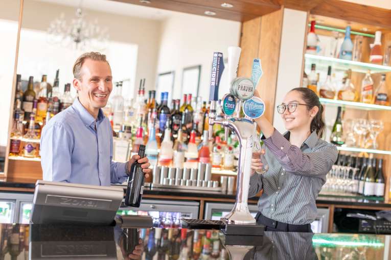 bar staff behind bar at the royal duchy hotel