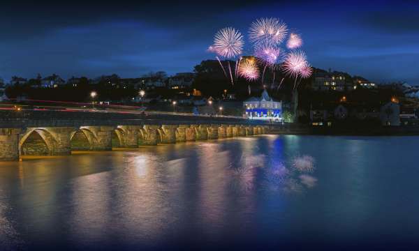 Royal Hotel Exterior Over Bideford Bridge at Night with Fireworks