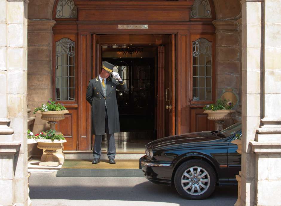 Victoria Hotel Doorman Greeting Arriving Car