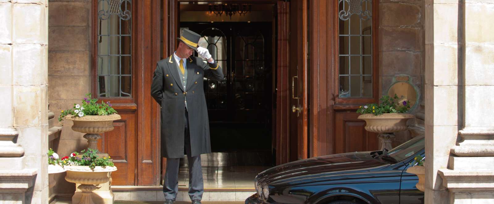Victoria Hotel Doorman Greeting Arriving Car