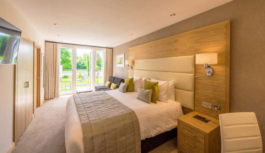 Park Hotel Accommodation (106) Bedroom with Seating and Outdoor Patio