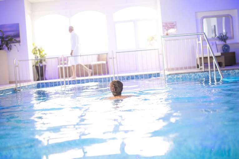 Royal Duchy Hotel Guest Swimming in Indoor Pool