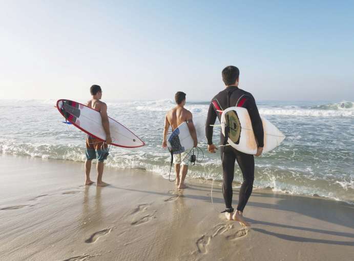 Saunton Sands Hotel Group of Guests With Surfboards on Saunton Beach