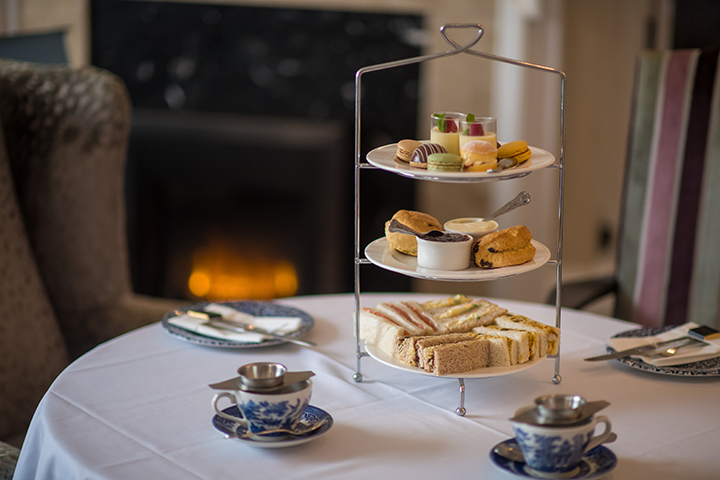 Imperial Hotel afternoon tea on table in front of roaring fire
