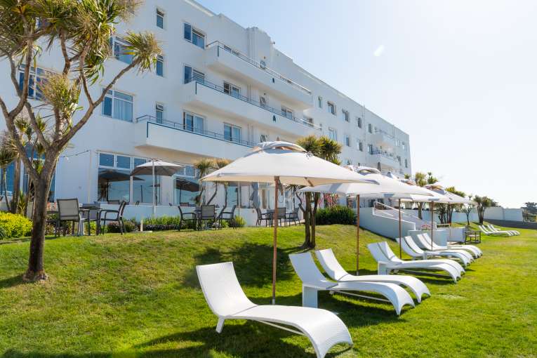 Sun beds on the lawn during summer
