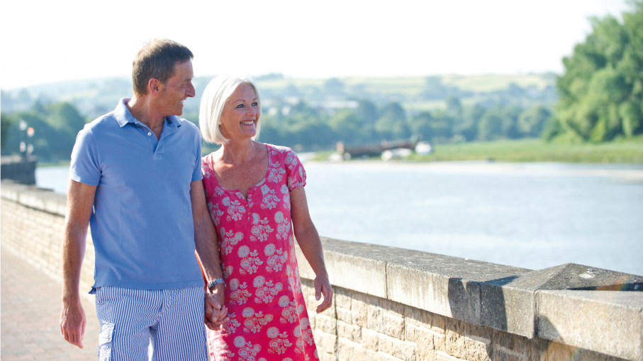 Couple walking along the River Taw in Barnstaple
