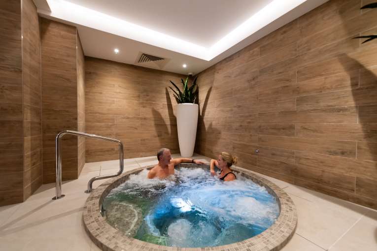 Couple in spa bath
