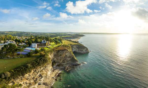 Aerial photo of the carlyon bay hotel showing beach below